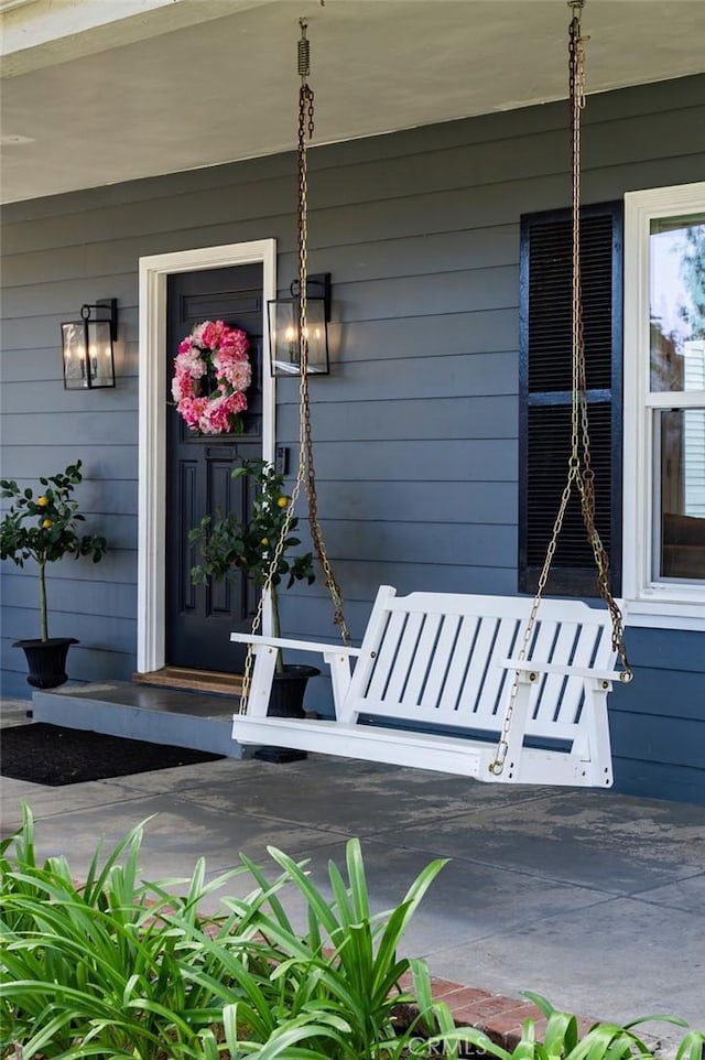 doorway to property featuring covered porch