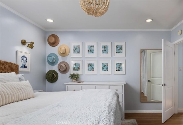 bedroom featuring crown molding, wood-type flooring, and an inviting chandelier