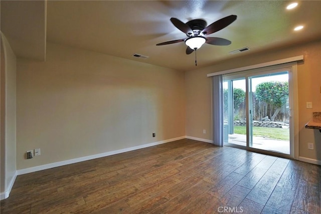 unfurnished room featuring dark hardwood / wood-style flooring and ceiling fan