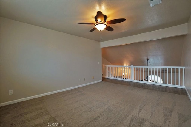 spare room with carpet floors and ceiling fan