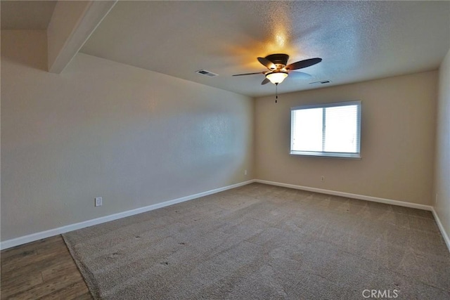 unfurnished room featuring a textured ceiling and ceiling fan