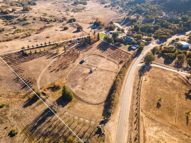 birds eye view of property featuring a rural view