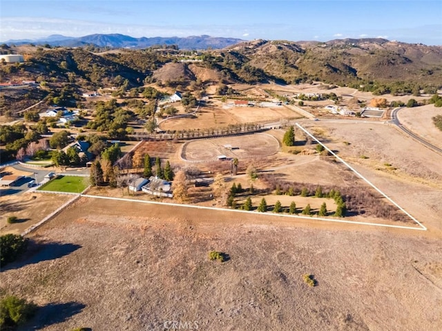 drone / aerial view featuring a mountain view