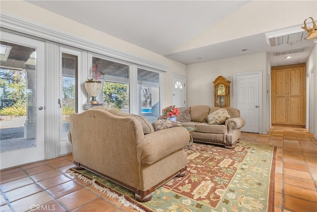 living room featuring lofted ceiling