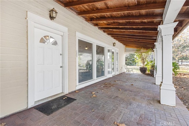 doorway to property featuring a porch