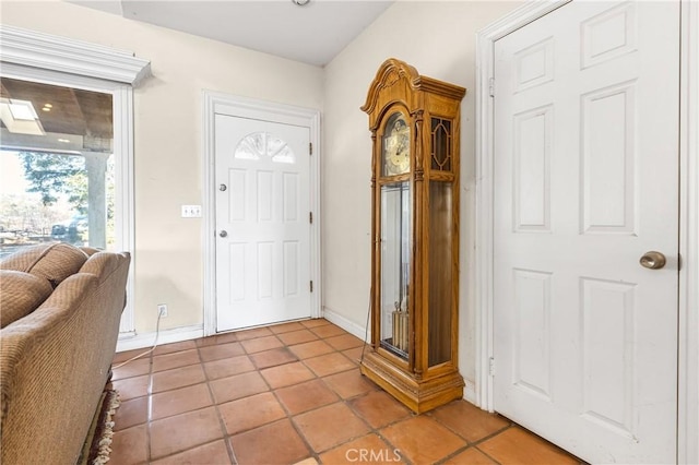 foyer entrance with light tile patterned floors