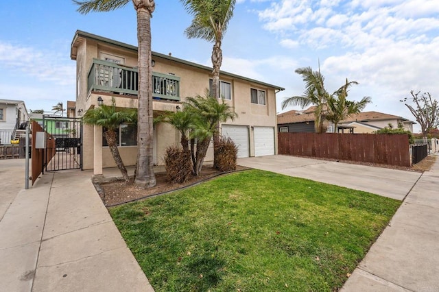 view of front of house with a balcony, a garage, and a front yard