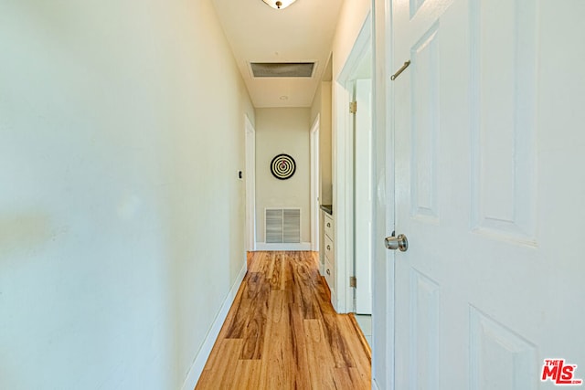 corridor featuring light hardwood / wood-style flooring