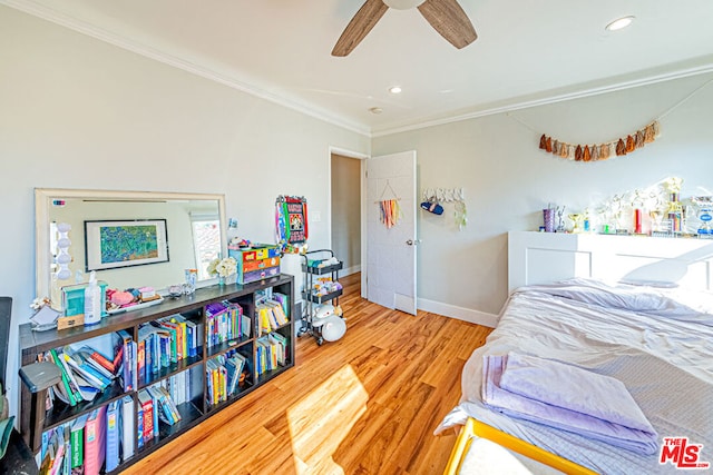 bedroom with crown molding, ceiling fan, and light wood-type flooring