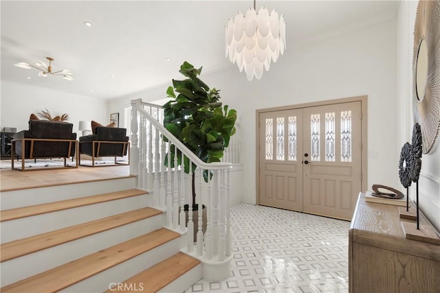 entrance foyer featuring a notable chandelier