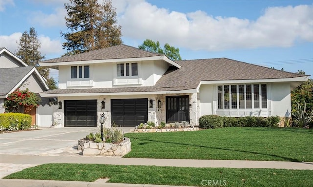 view of front of home with a garage and a front yard