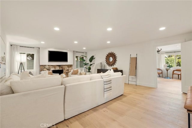 living room featuring a fireplace and light hardwood / wood-style flooring