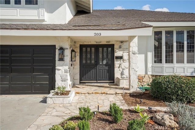 view of exterior entry featuring a garage