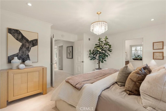 carpeted bedroom featuring ornamental molding and a chandelier