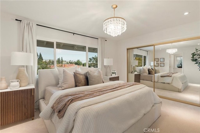 carpeted bedroom featuring radiator heating unit, an inviting chandelier, and a closet