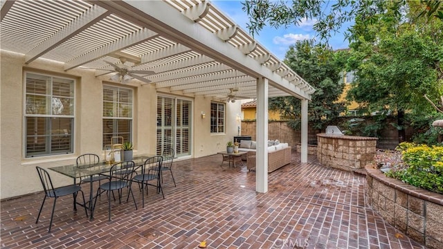 view of patio with an outdoor living space, a pergola, ceiling fan, and exterior kitchen