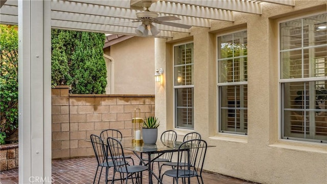 view of patio with ceiling fan and a pergola