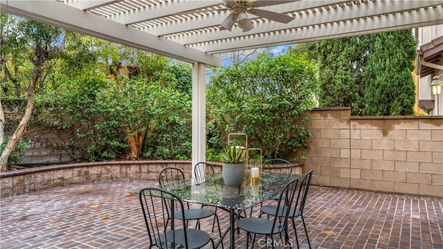 view of patio / terrace featuring ceiling fan and a pergola