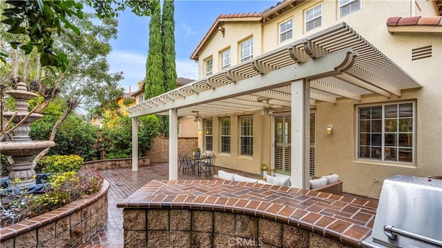 view of patio / terrace featuring a grill, ceiling fan, and a pergola