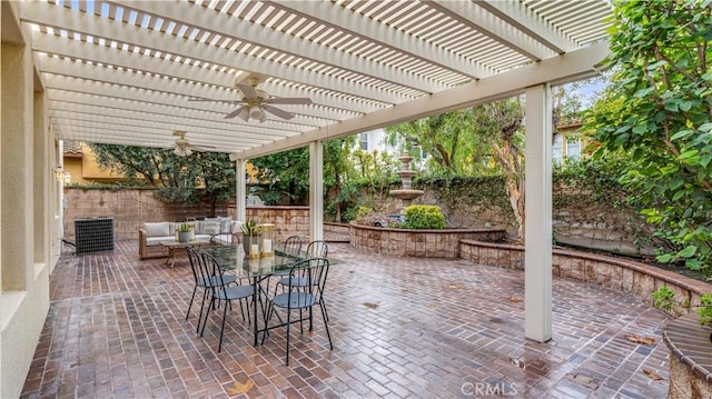 view of patio with an outdoor living space, ceiling fan, and a pergola