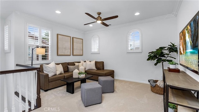 living room with ornamental molding, light colored carpet, and ceiling fan