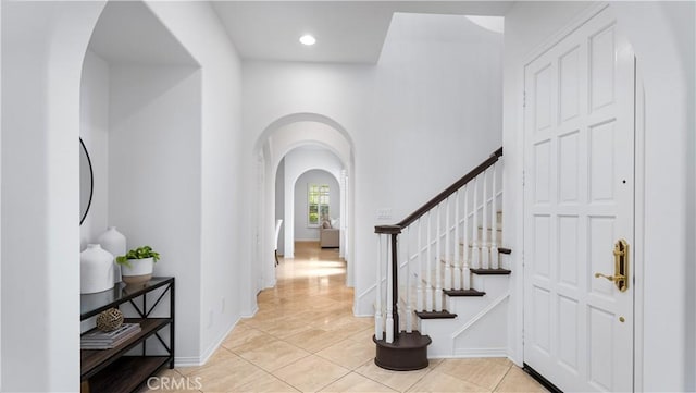 entryway featuring light tile patterned flooring