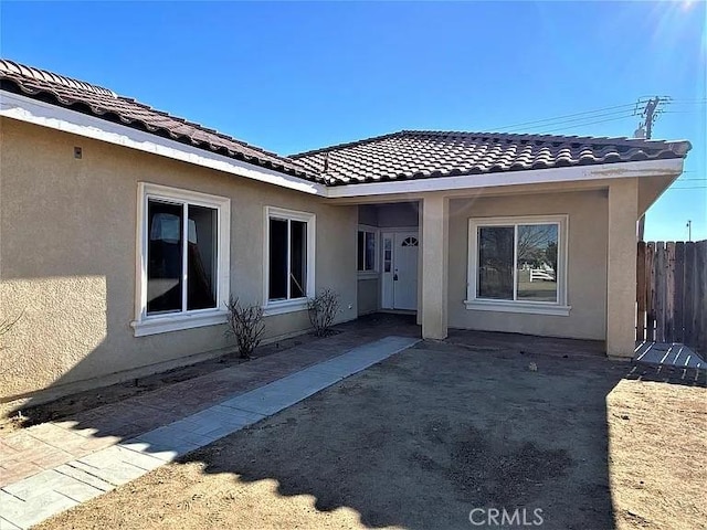 entrance to property with a patio area