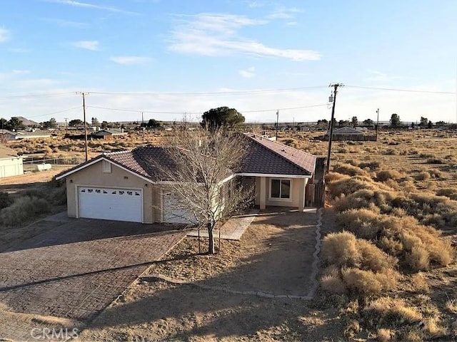 ranch-style home featuring a garage