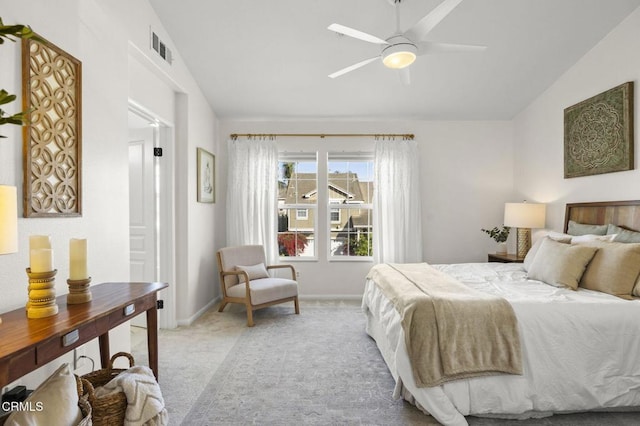 carpeted bedroom featuring lofted ceiling and ceiling fan