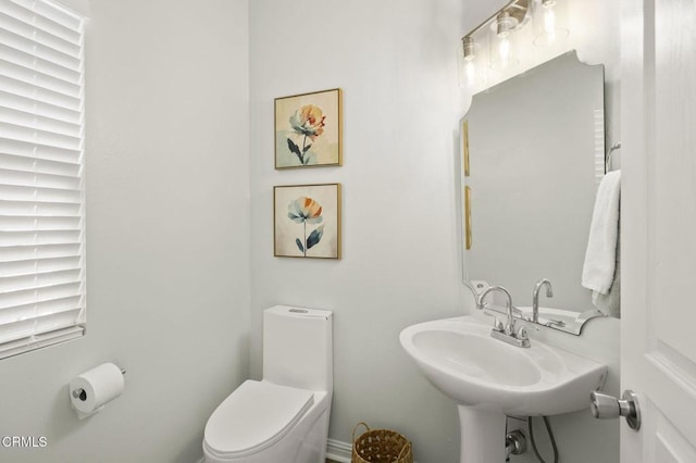 bathroom with sink and toilet