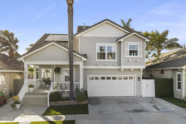 front facade featuring a garage and covered porch