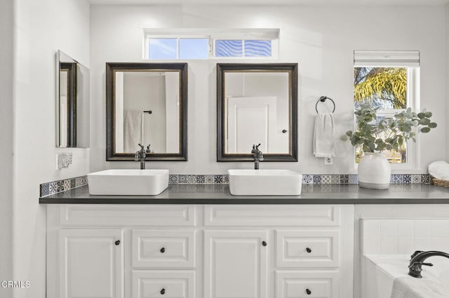 bathroom with vanity and a bathing tub