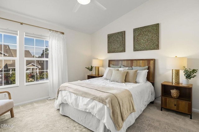 carpeted bedroom with ceiling fan and lofted ceiling