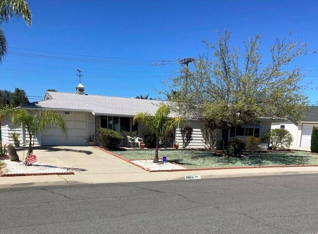 ranch-style house featuring a garage