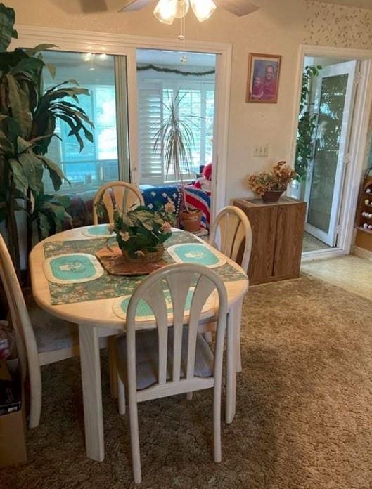 dining room with carpet floors and ceiling fan