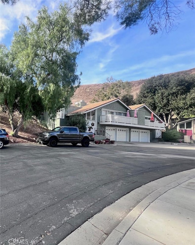 view of front of home featuring a garage and a mountain view