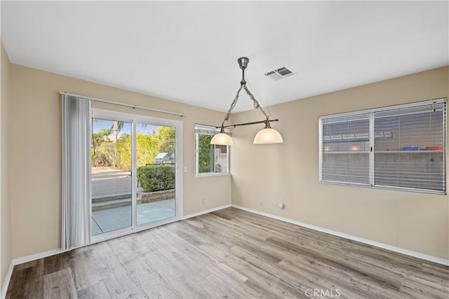 30340 Channel Way Dr, Canyon Lake, CA 92587 - unfurnished room with visible vents, baseboards, and wood finished floors