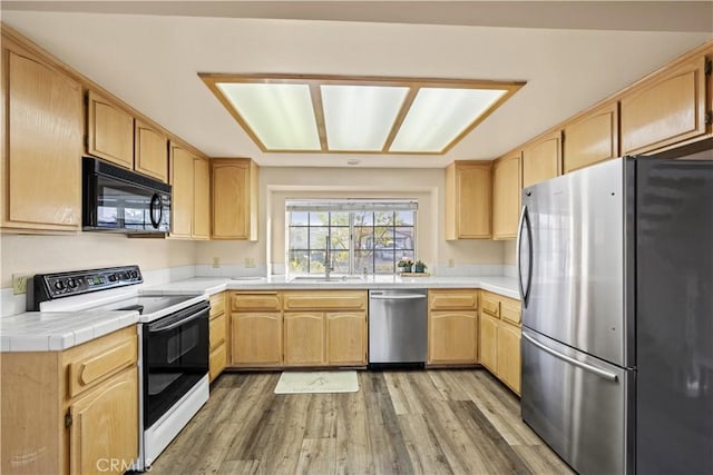 30340 Channel Way Dr, Canyon Lake, CA 92587 - kitchen with a sink, light wood finished floors, light brown cabinetry, and stainless steel appliances