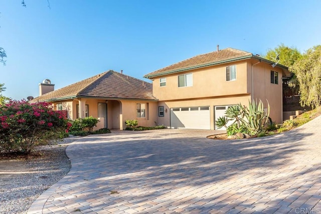 front of property with a garage