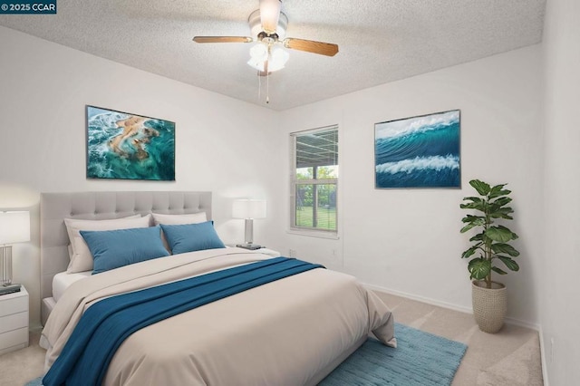 carpeted bedroom with ceiling fan and a textured ceiling