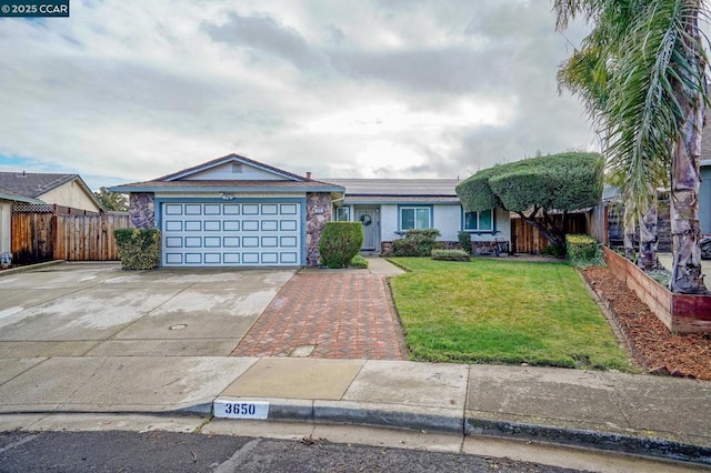 view of front facade with a garage and a front lawn