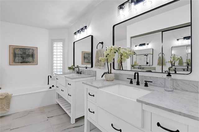 bathroom with vanity and a bathing tub