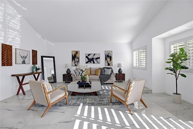 living room with high vaulted ceiling