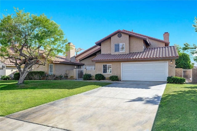 view of front of property with a garage and a front yard