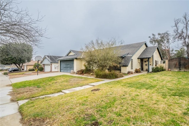 view of front of home with a garage and a front yard