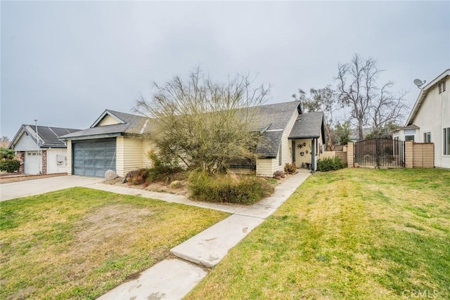 view of front of house with a garage and a front lawn