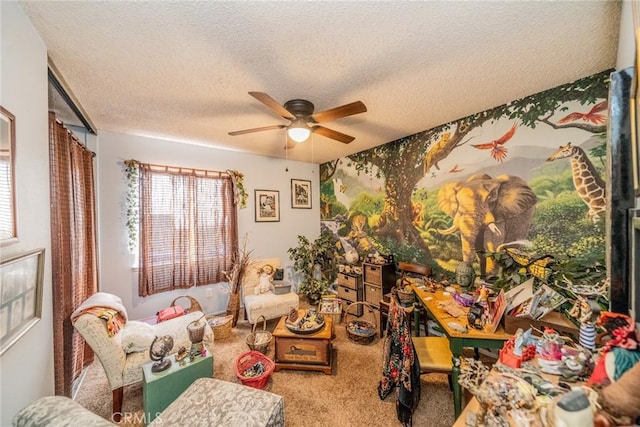 interior space featuring ceiling fan, carpet floors, and a textured ceiling