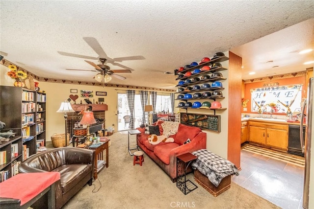 living room featuring ceiling fan, light colored carpet, and a textured ceiling