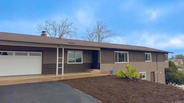 ranch-style home featuring a garage