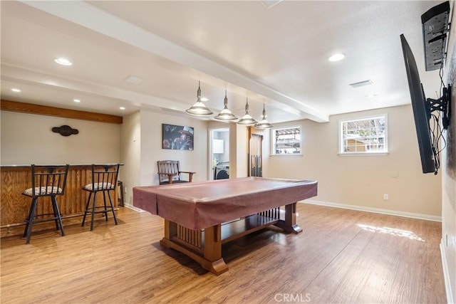 recreation room with a dry bar, baseboards, pool table, light wood-style floors, and beam ceiling